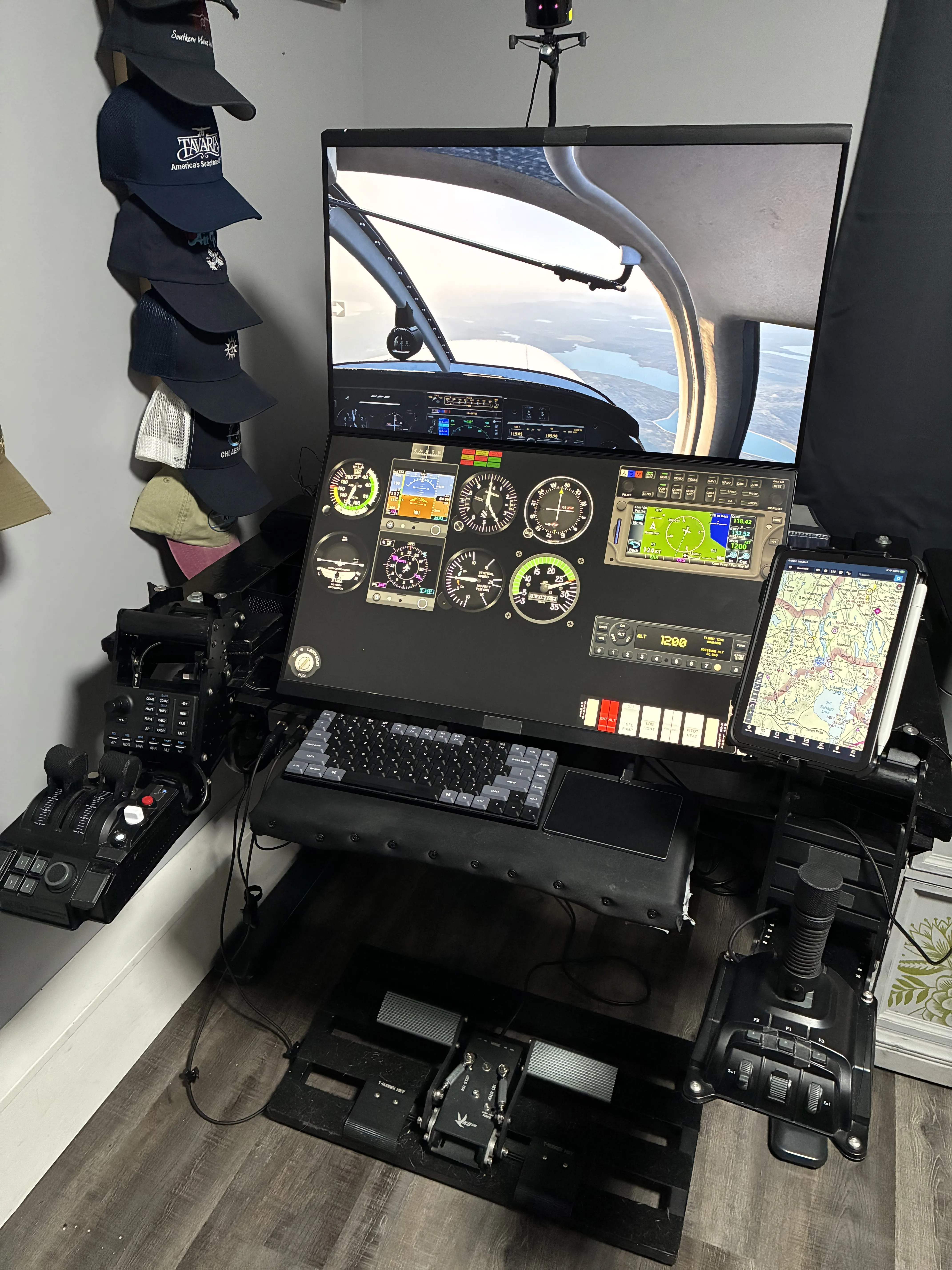 Home flight simulator setup running X-Plane 12 with ForeFlight, Air Manager, and RealityXP GTN 650